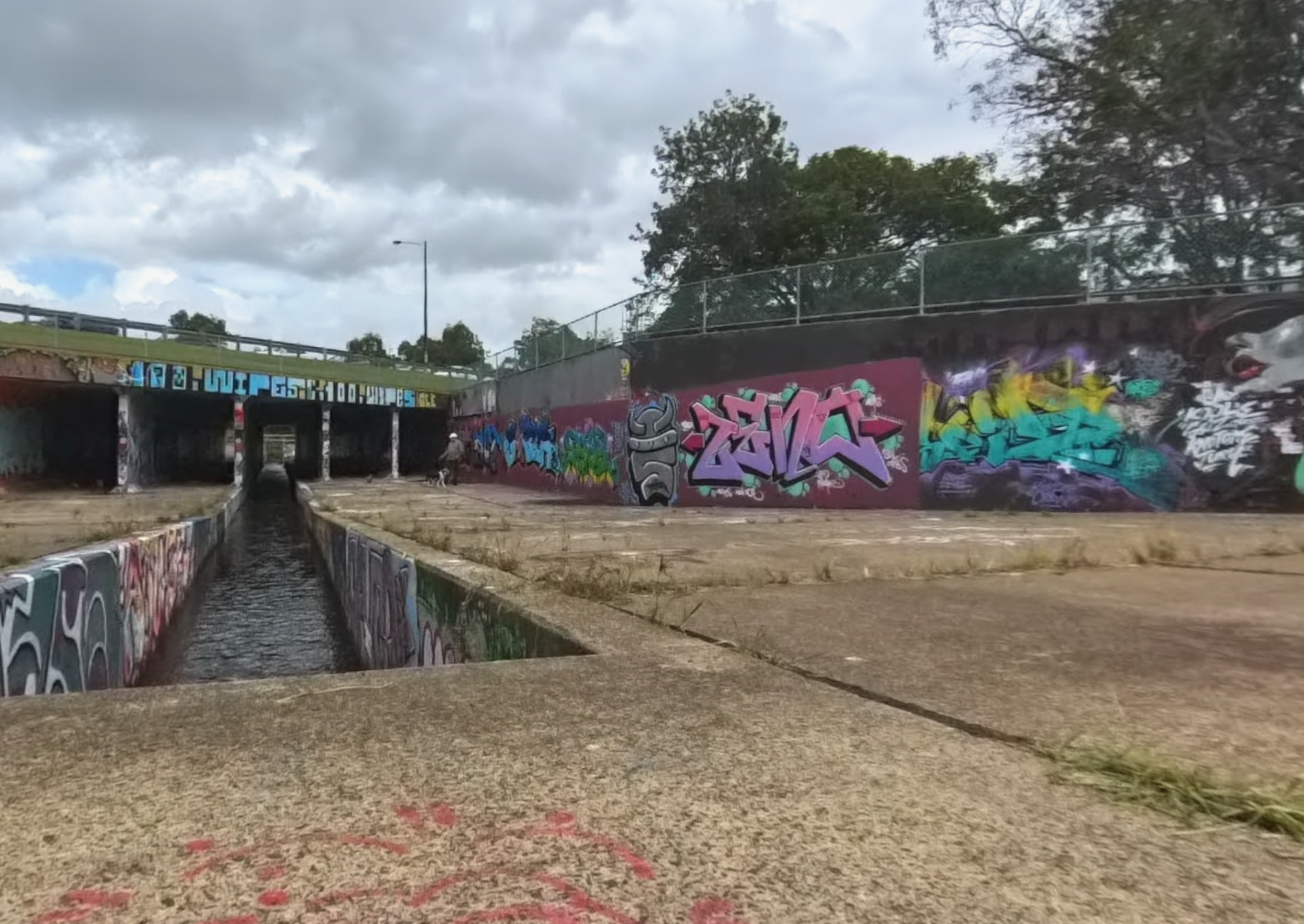 Supplied photograph of painted walls and a shared path beside a drainage channel